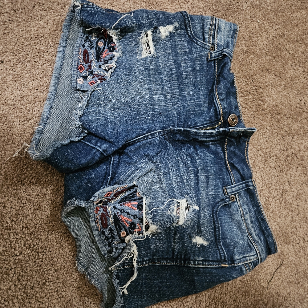 Distressed Denim Shorts with Patterned Patches
